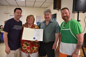 L-R: Fairhaven Selectboard Chairperson Charles Murphy, Linda Meredith, State Sen. Michael Brady, Greg Belcher. State senator Mciahel Brady presents Linda Meredith with a citation from the state House of Representatives acknowledging her ”many years of selfless and dedicated volunteer service to the citizens of Fairhaven.” Photo by Beth David