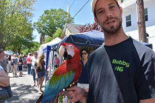 Zaboo, a Green Winged Macaw, a type of parrot. With Robert Surdam of Fhvn