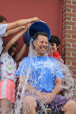 Robert Mota, Assistant Principal of Student Services at Hastings Middle School, gets soaked by students Emma Fleurent and Deigo Perry as part of a fund-raiser for Cystic Fibrosis. Photo by Jean Perry
